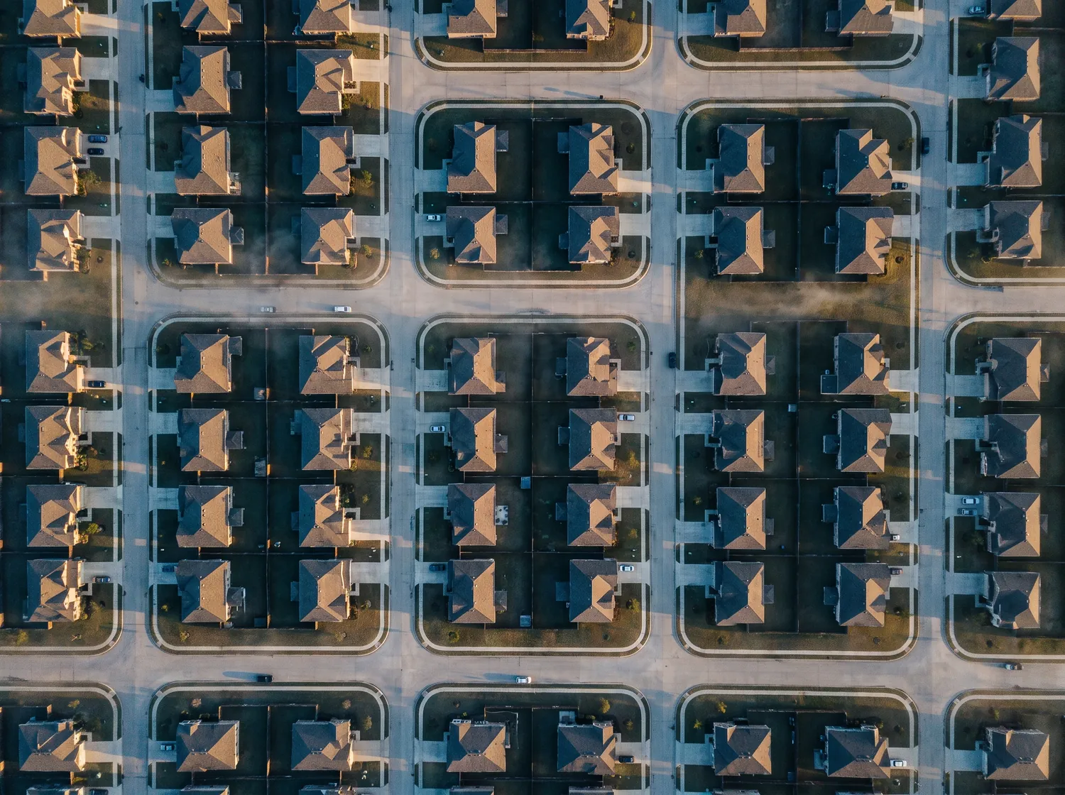 Aerial view at first light of a dense residential subdivision